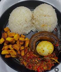 Ofada Rice served with stew and dried fish